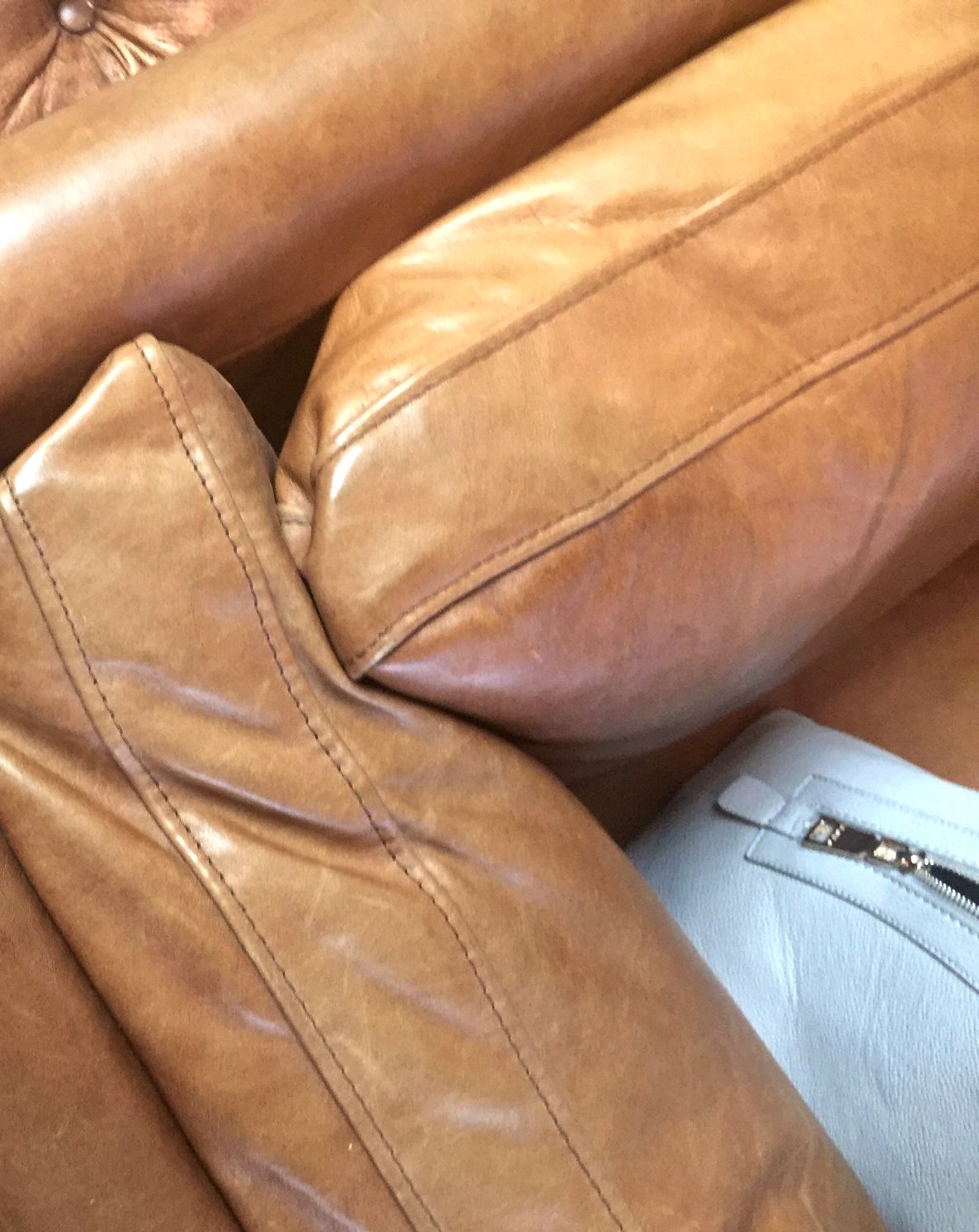 Private couch in a naked tan leather