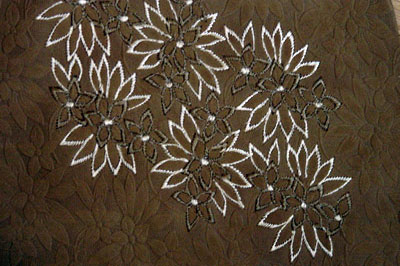 Gaufrage embossing with hand-stiched custom embroidery